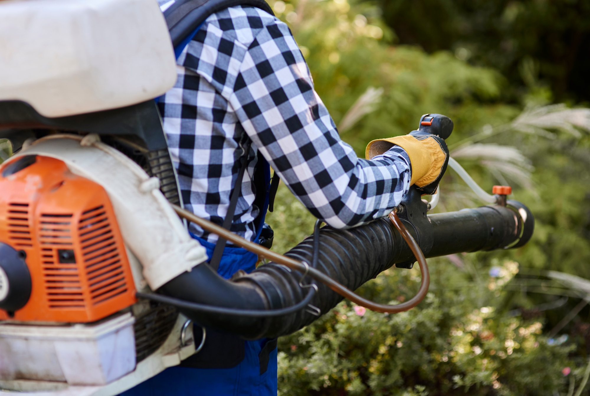Man using modern leaf blower